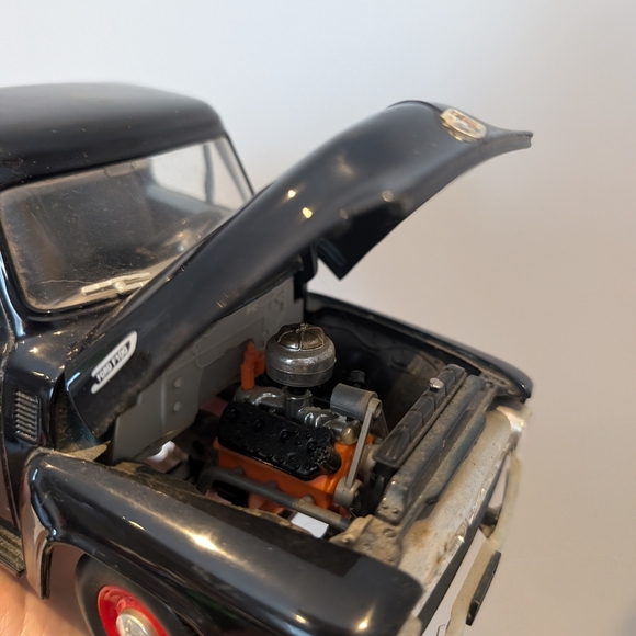 Classic Black Toy Truck with Red Wheels - Picture 7 of 11